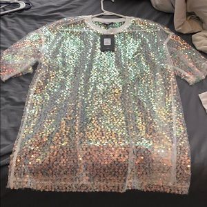 Over sized sparkly shirt.
